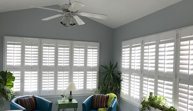 Houston sunroom with fan and shutters